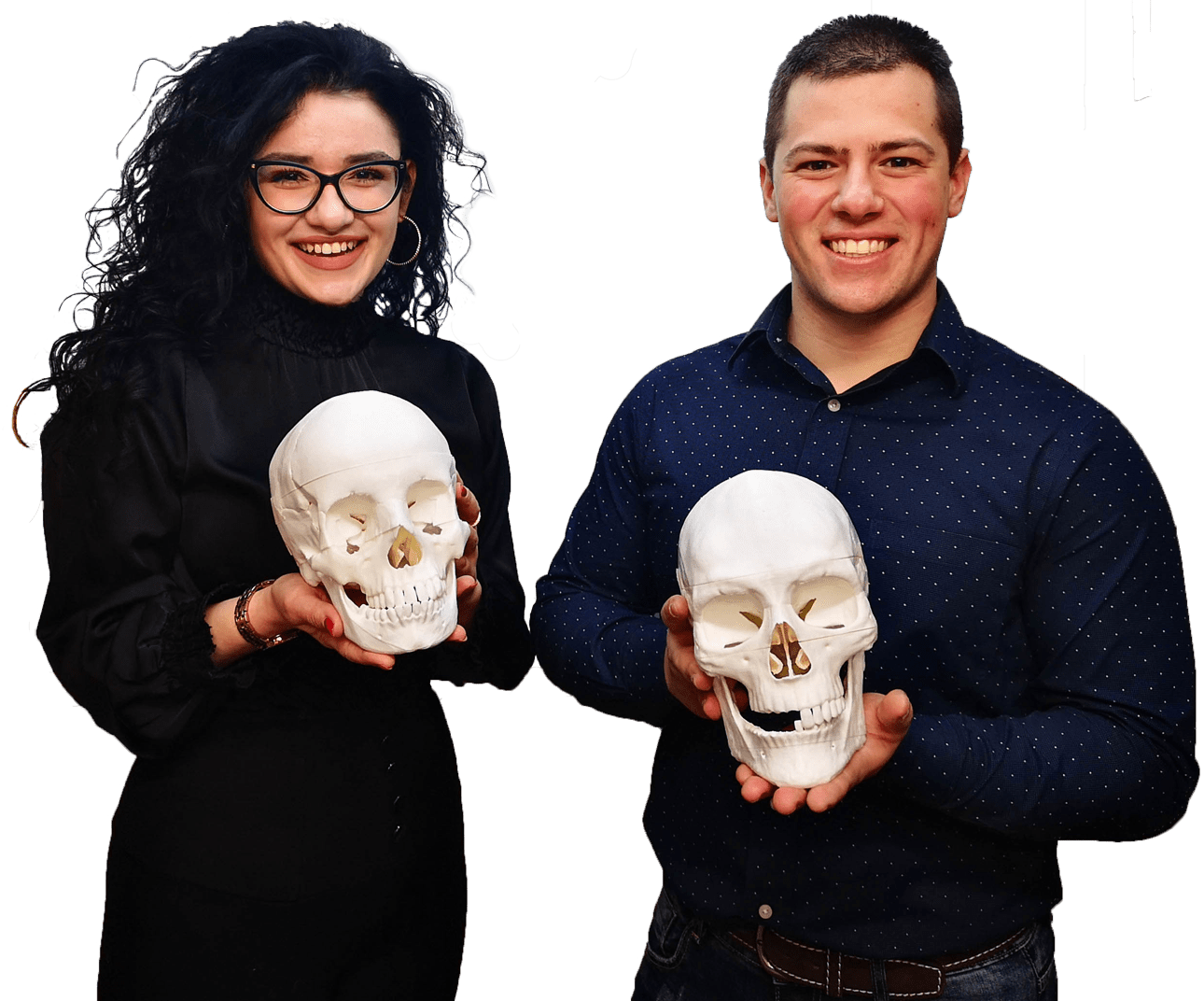 Students holding skull models
