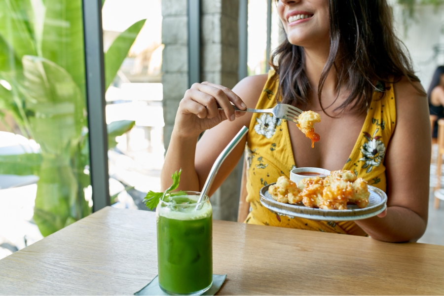 woman drinking a smoothie