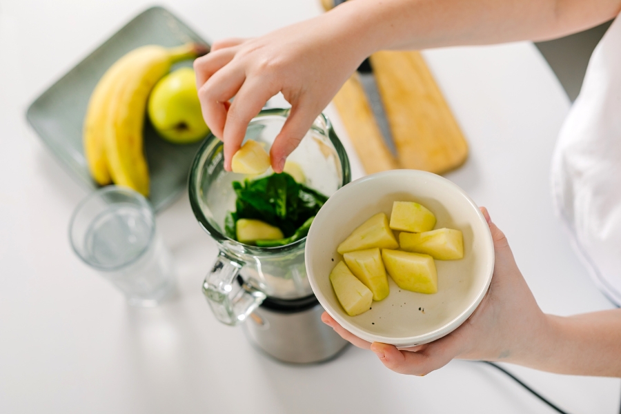 woman making a smoothie