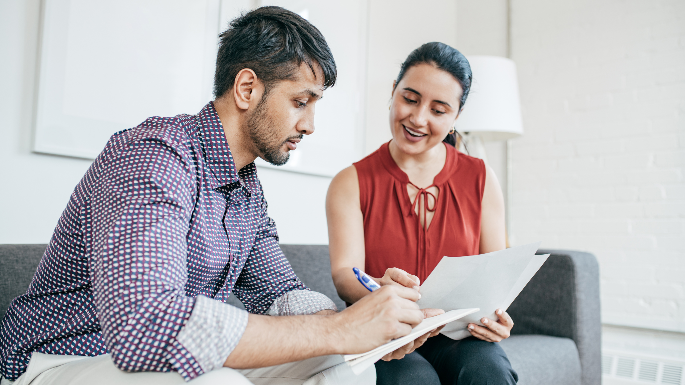Bookkeeper reviewing documents with a client during a collaborative meeting Bookkeeper reviewing documents with a client during a collaborative meeting