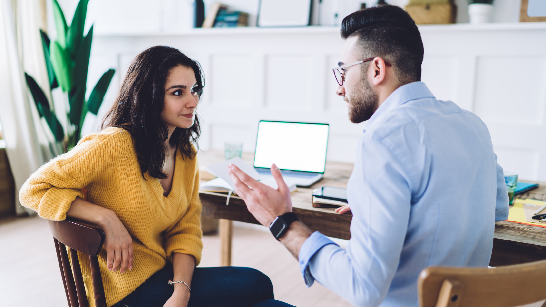 Bookkeeper having a relaxed sales conversation with a potential client Bookkeeper having a relaxed sales conversation with a potential client