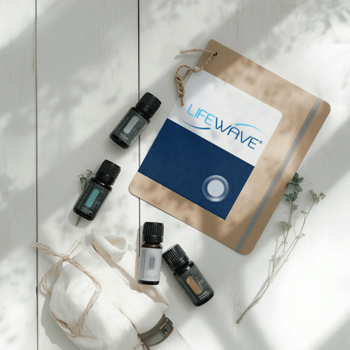 Essential oil bottles and a LifeWave patch card on a white table