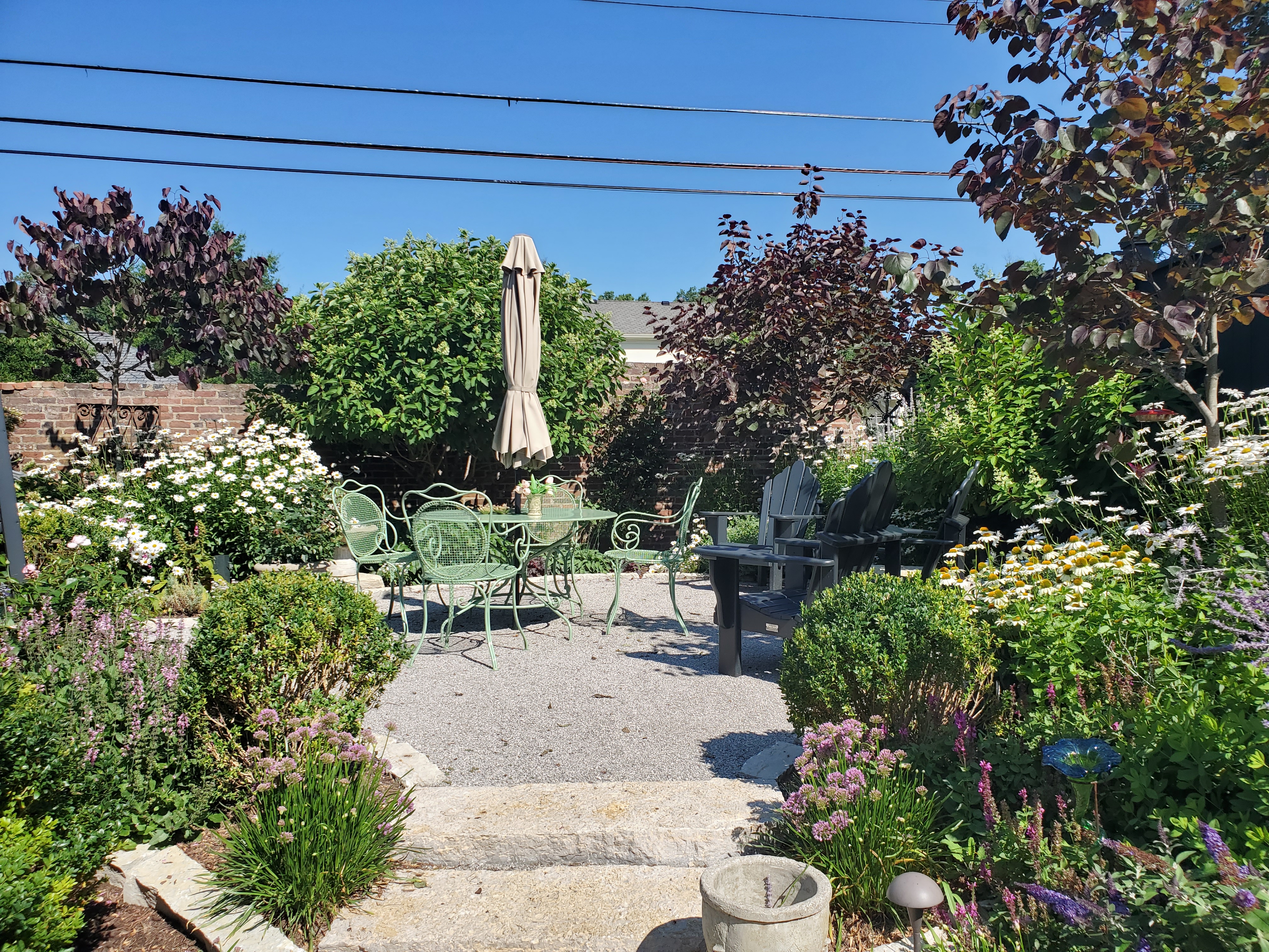 Beautiful landscaped yard with garden bed