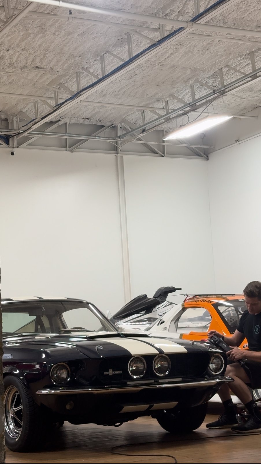 Classic muscle car being worked on in the studio