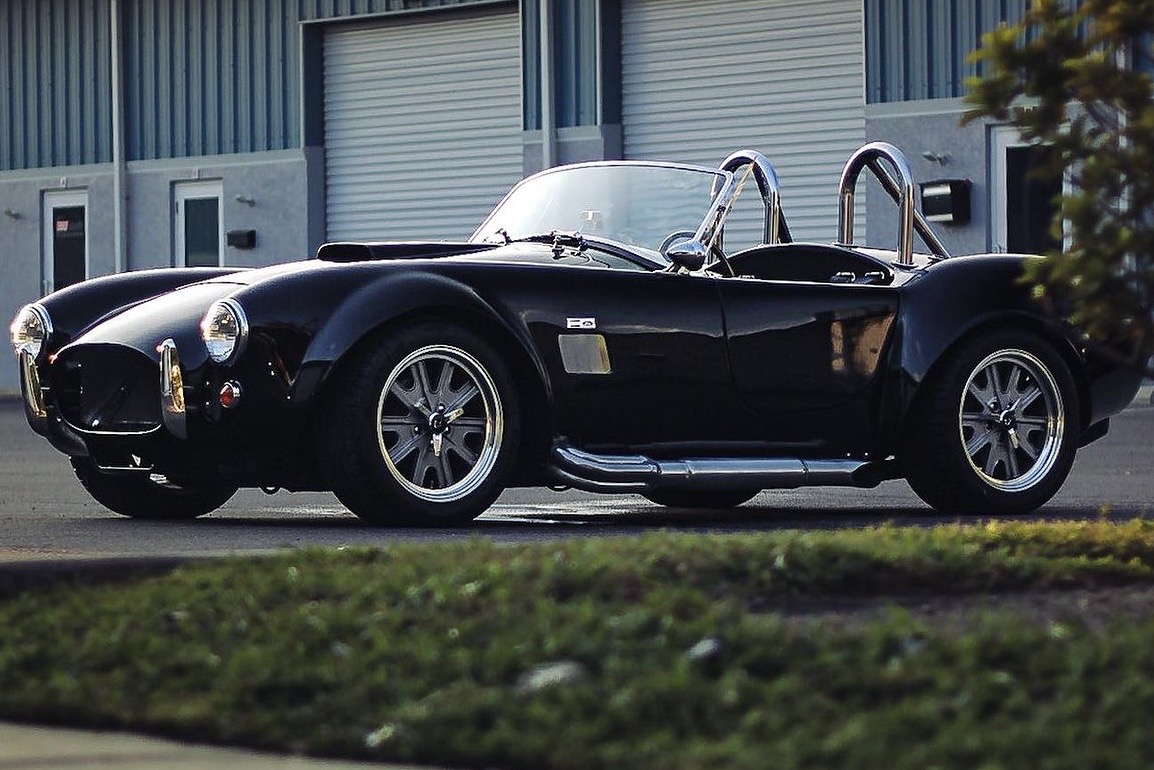 Black classic roadster parked outdoors