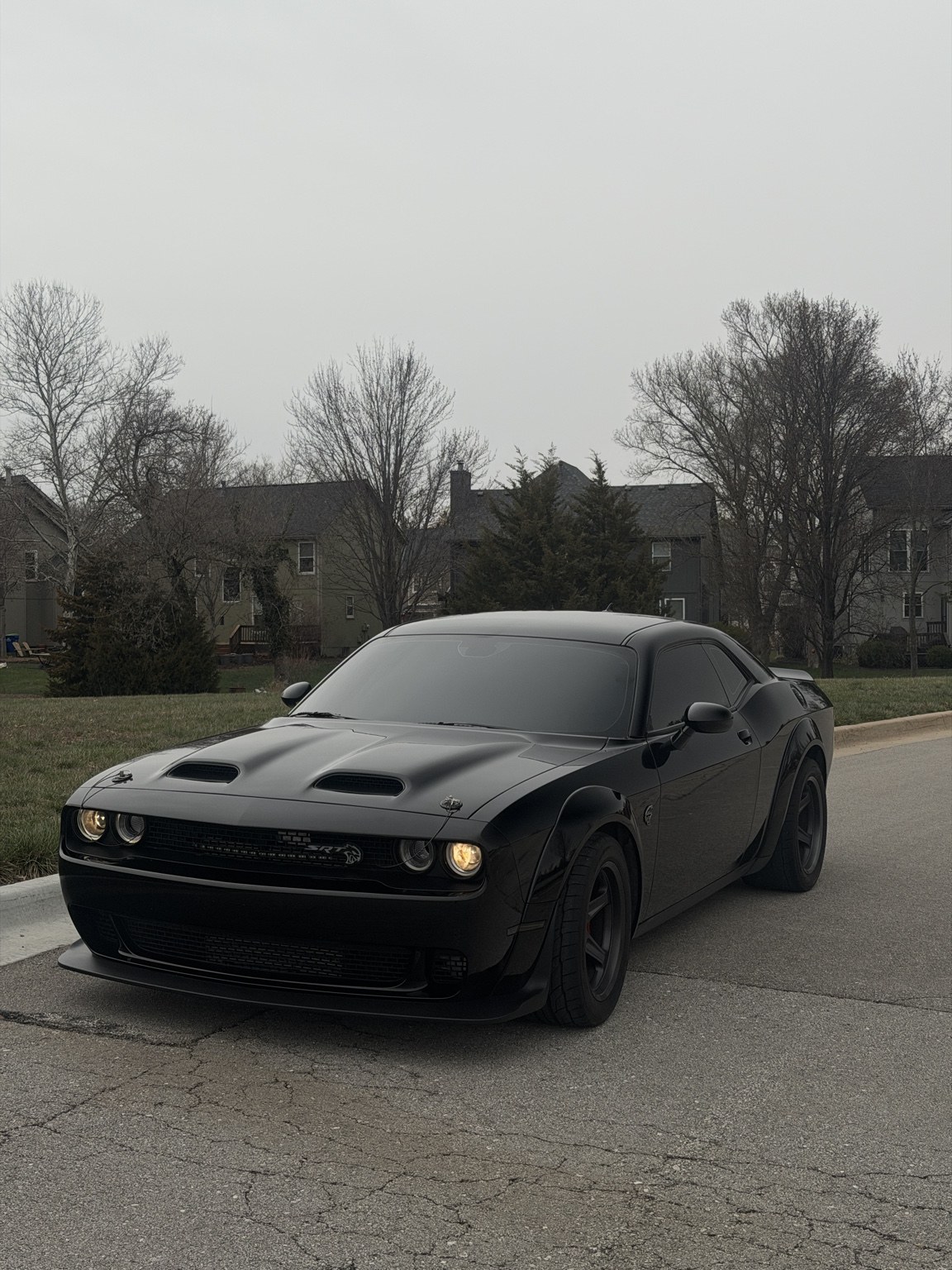 Black Dodge Challenger at a residential detail appointment