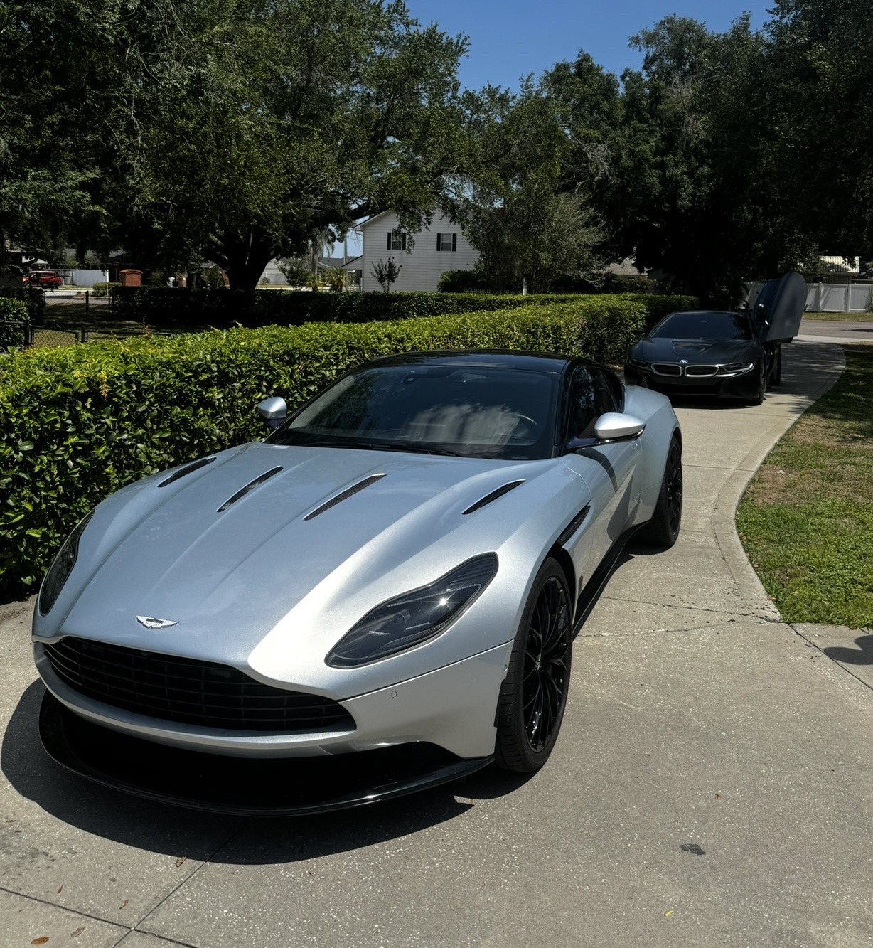 Silver Aston Martin photographed at a home
