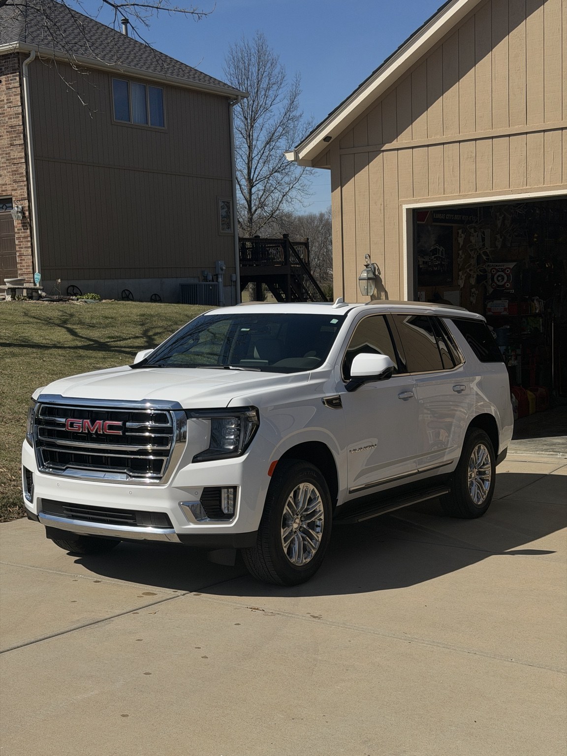 White GMC SUV at a driveway detail appointment