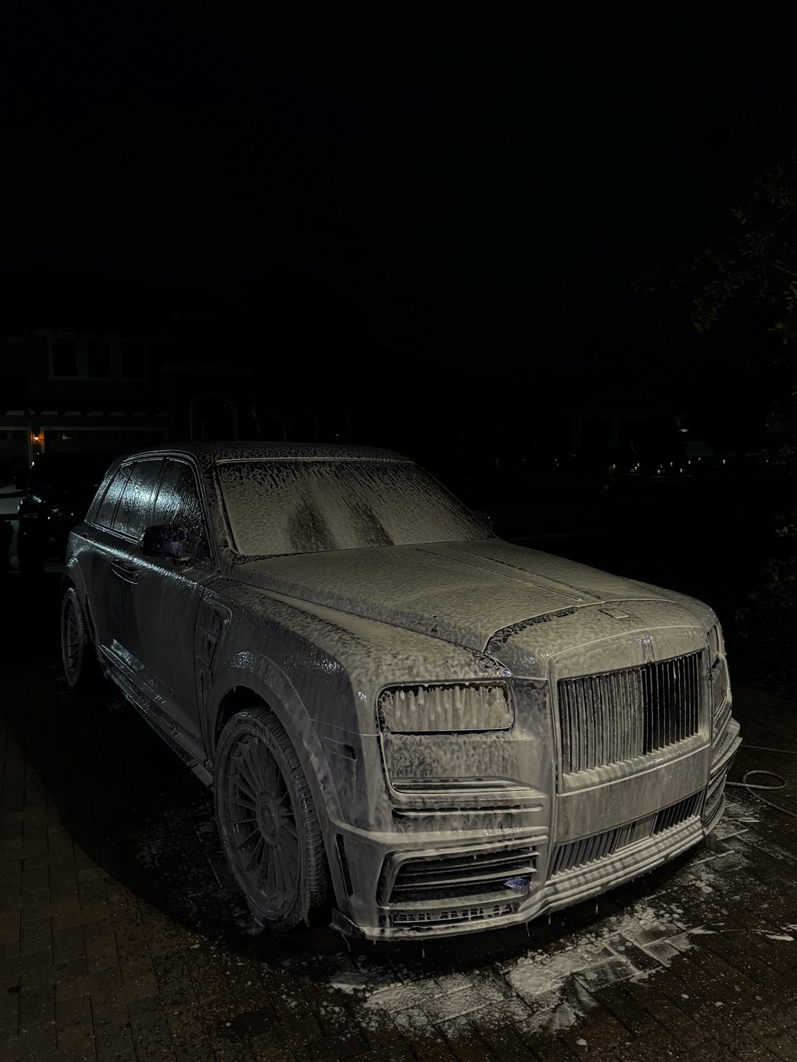 Rolls-Royce covered in wash foam during a detail