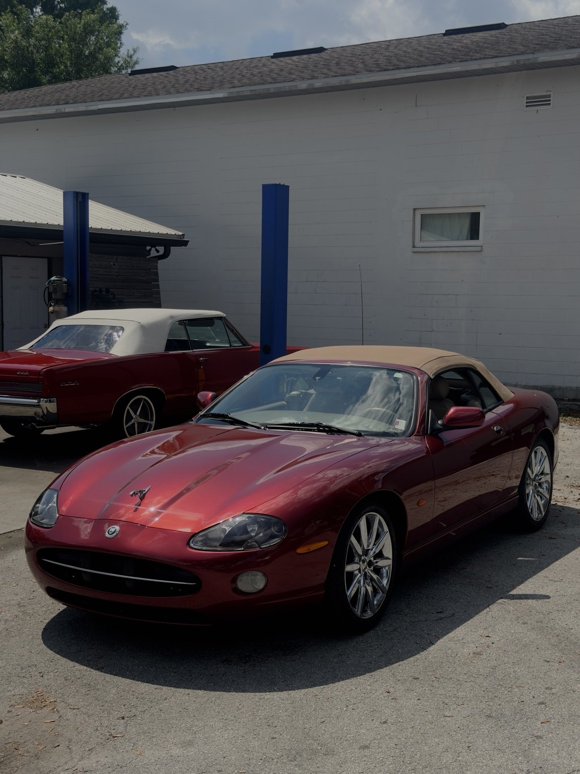 Red vintage roadster at the detailing shop
