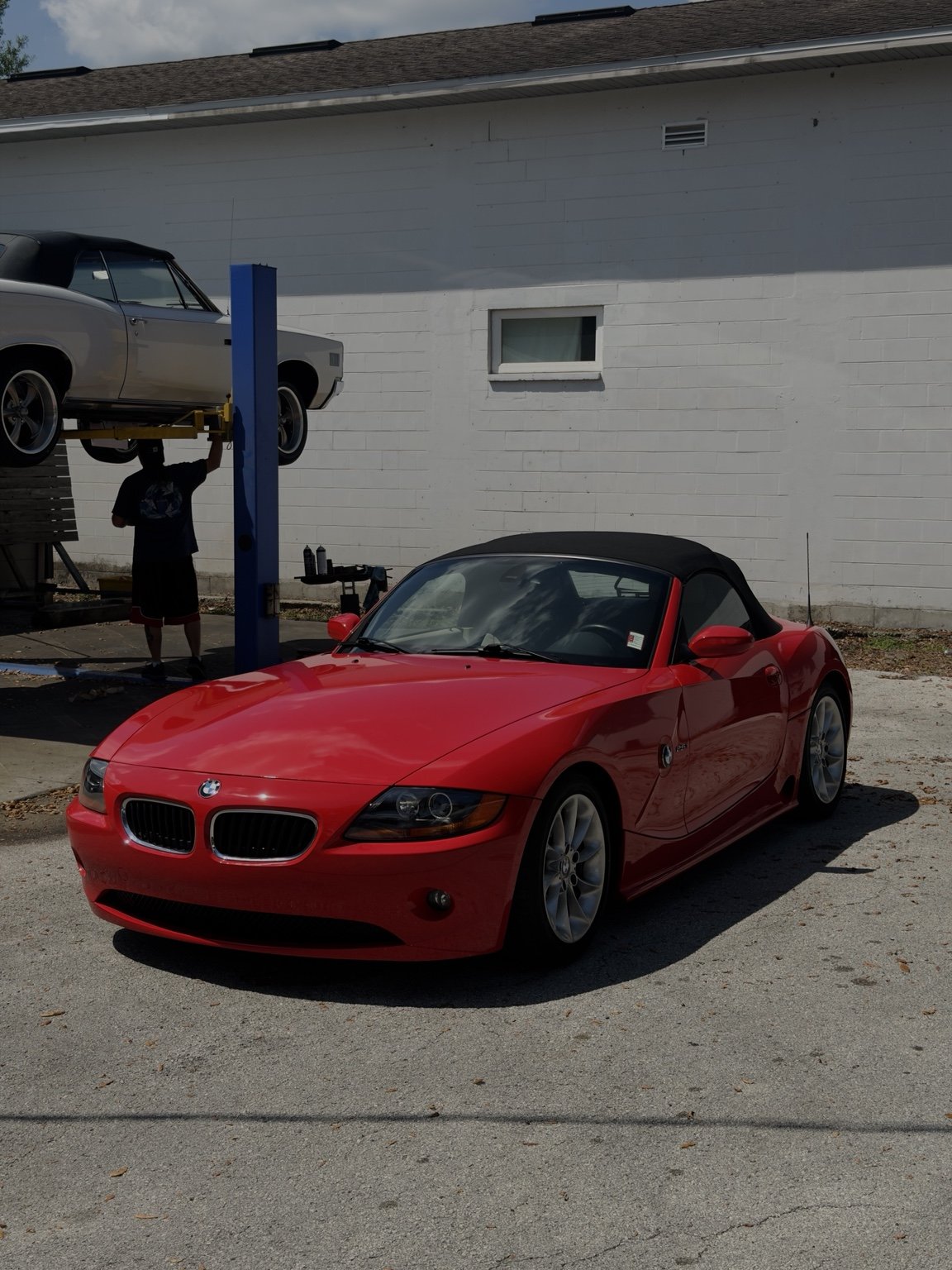 Red BMW roadster at the detailing shop