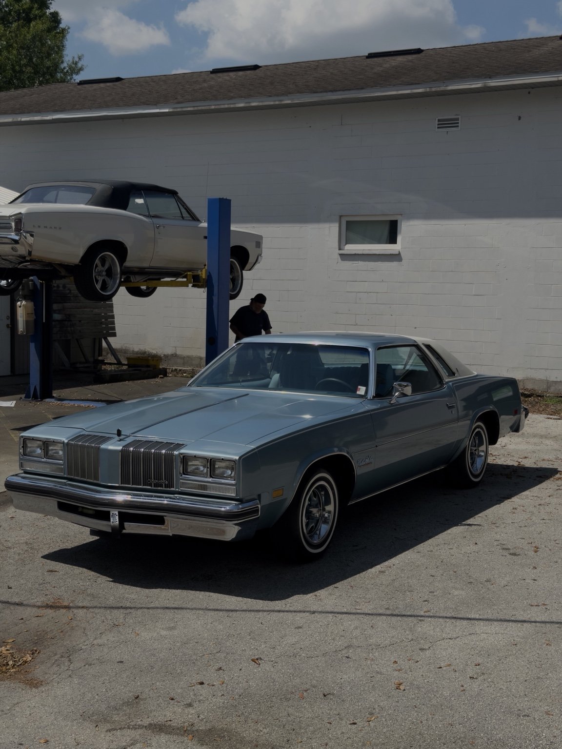 Silver classic coupe at the detailing shop