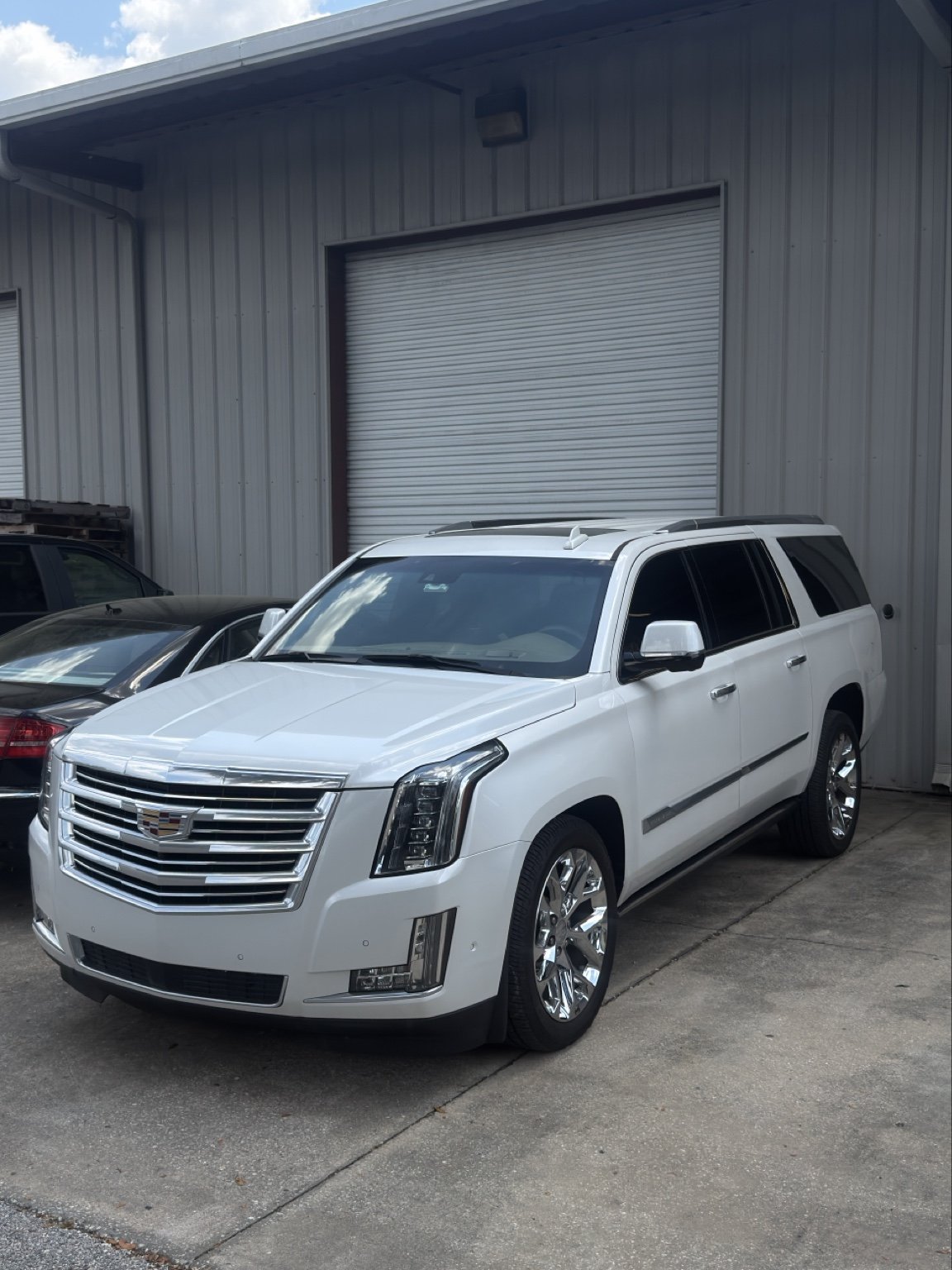 White luxury SUV at the detailing shop