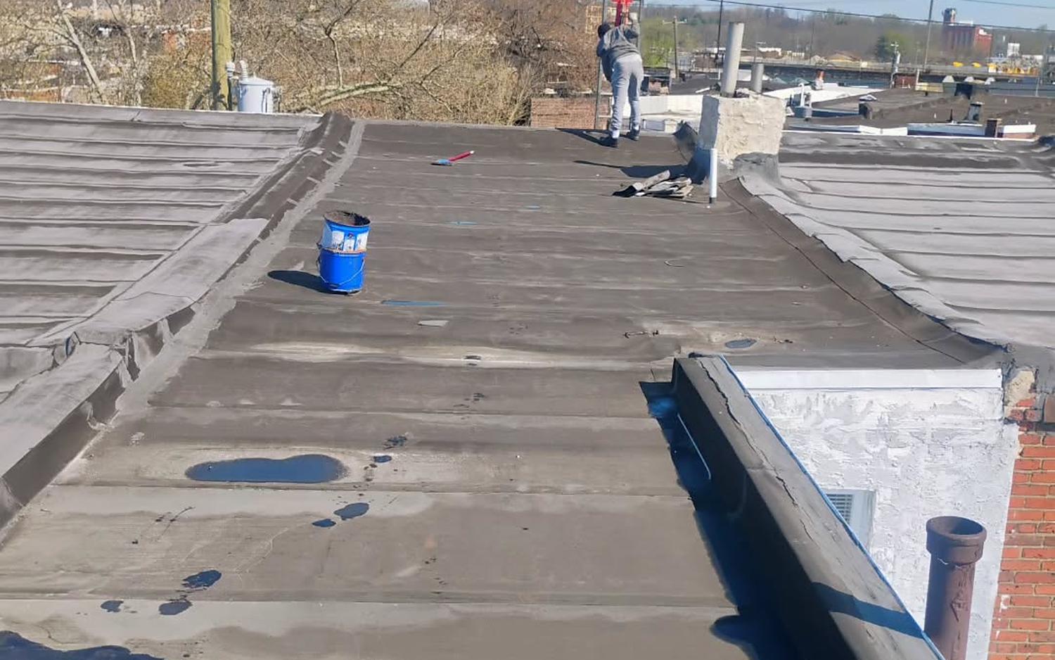 MG Roofing crew working on a Philadelphia flat roof