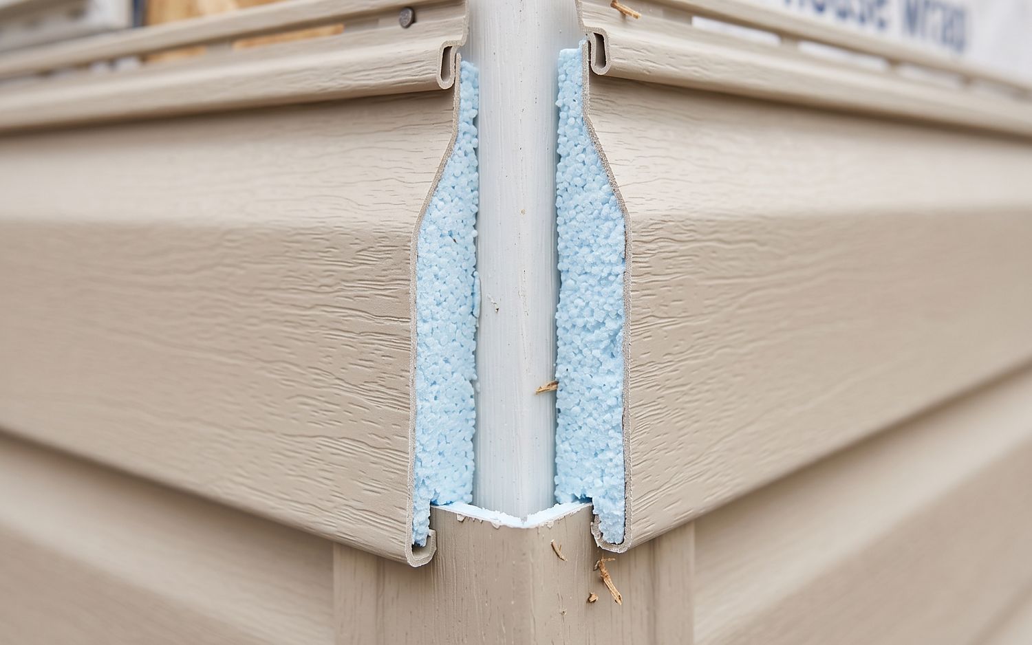 Foam-backed insulated vinyl siding sitting dead flat against the wall