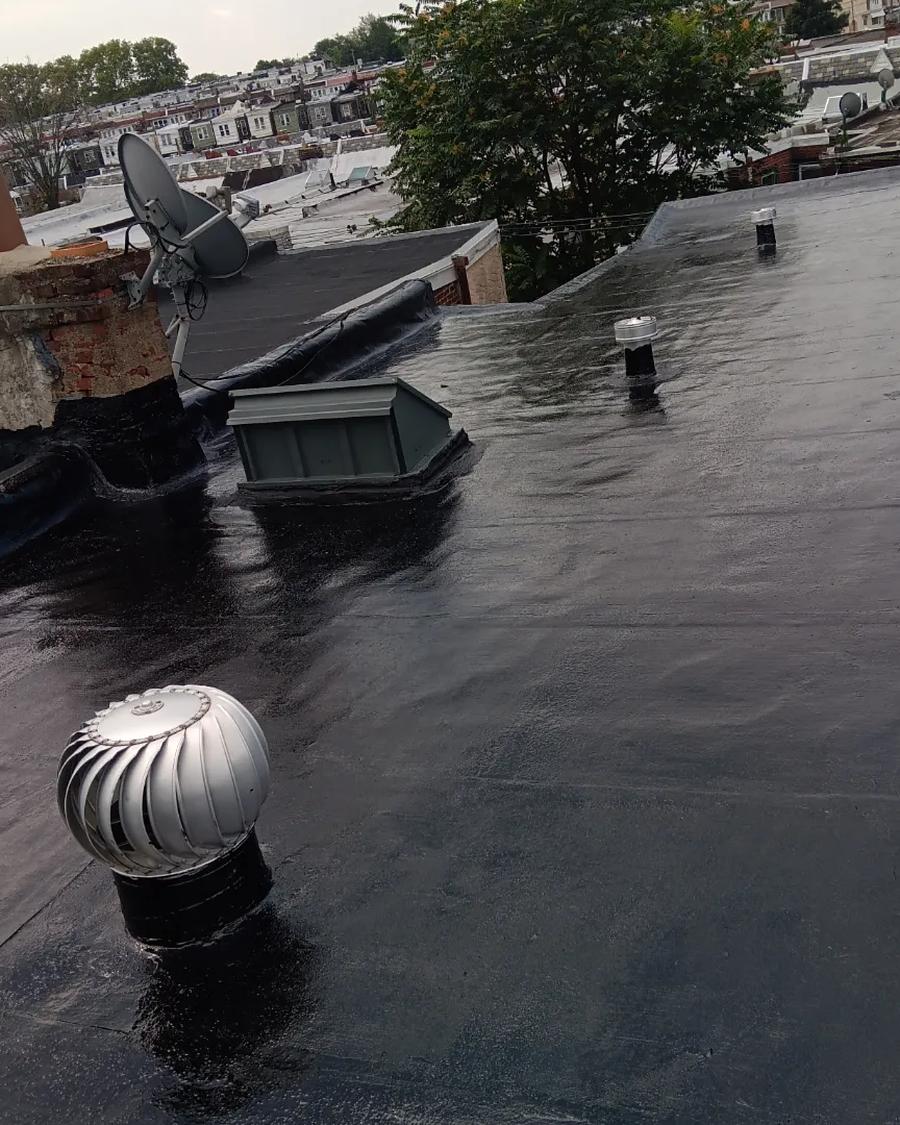 The same roof in new rubber membrane, turbine vent re-flashed