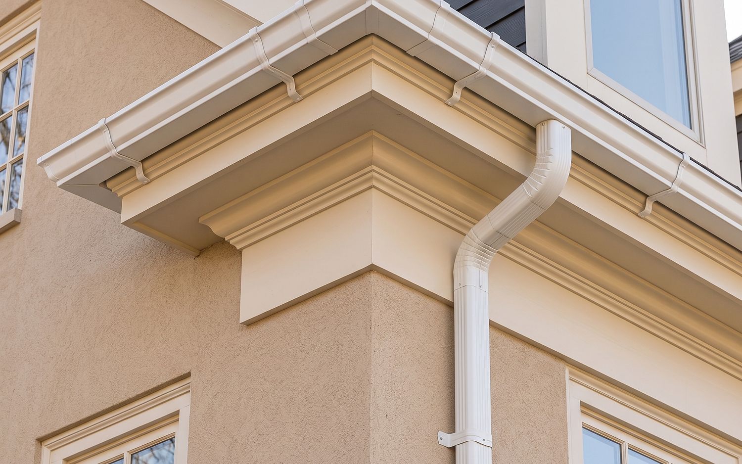 Snap-together sectional vinyl gutter, joints visible along the run