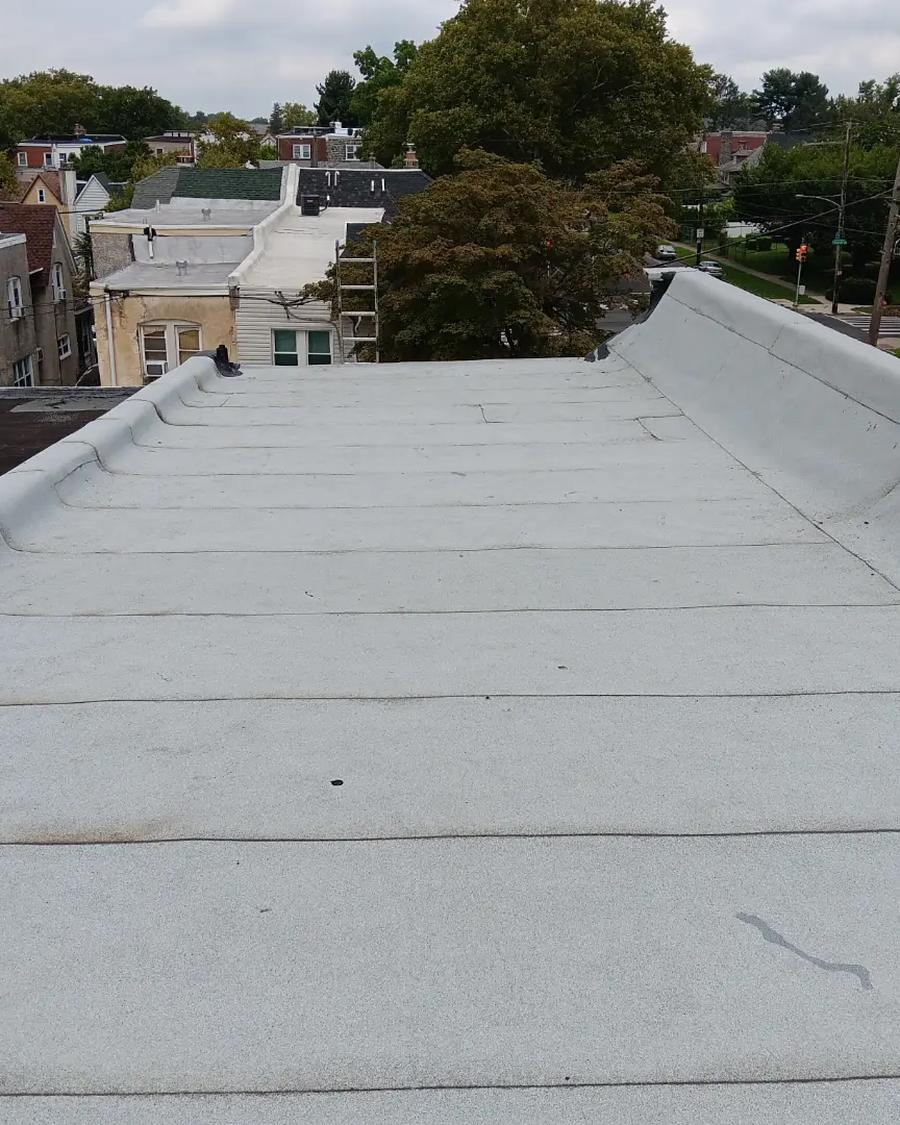 Finished silver-coated flat roof reflecting the sky