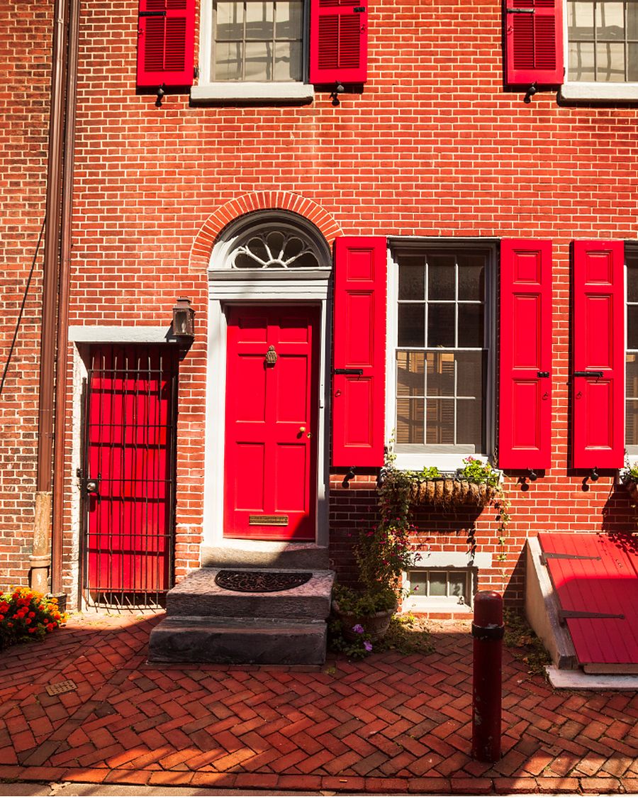 Sash windows and a front door on a Philadelphia brick row home