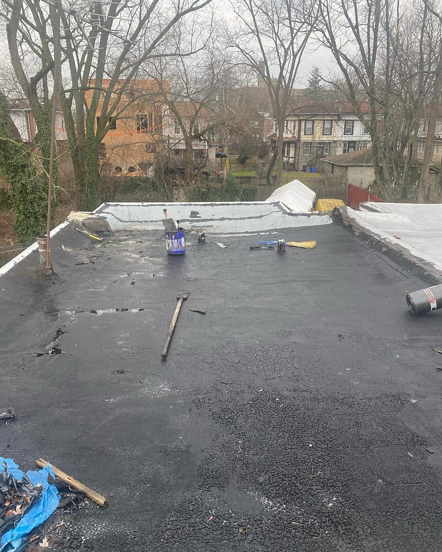Wet, stripped roof deck during tear-off