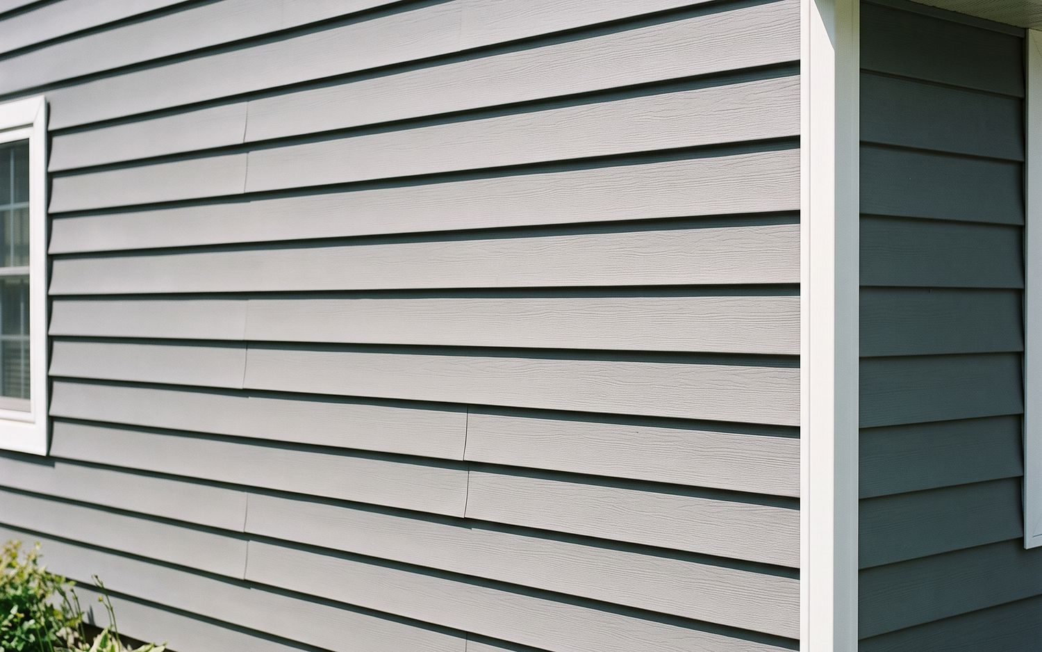 Horizontal vinyl clapboard lap siding with white corner trim