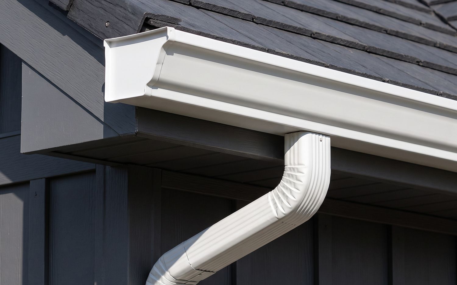 Six-inch K-style seamless gutter with an oversized downspout outlet