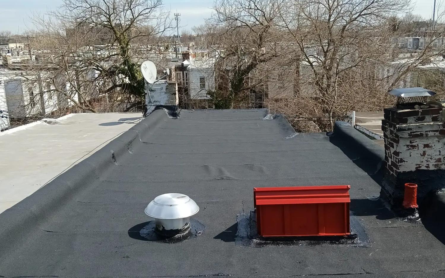 Completed flat roof replacement with new skylight curb, Philadelphia