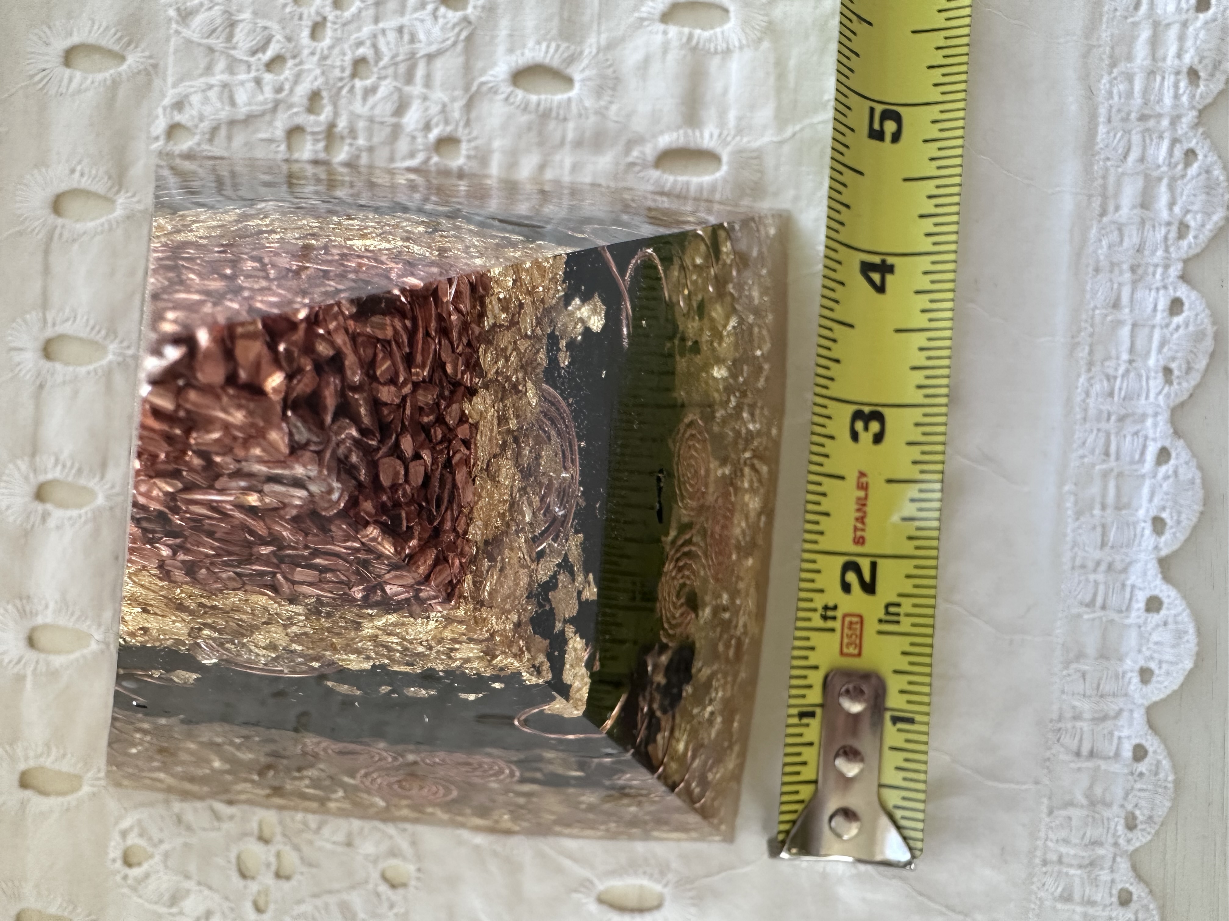 Small orgonite pyramid width measurement showing approximately 4 inch base