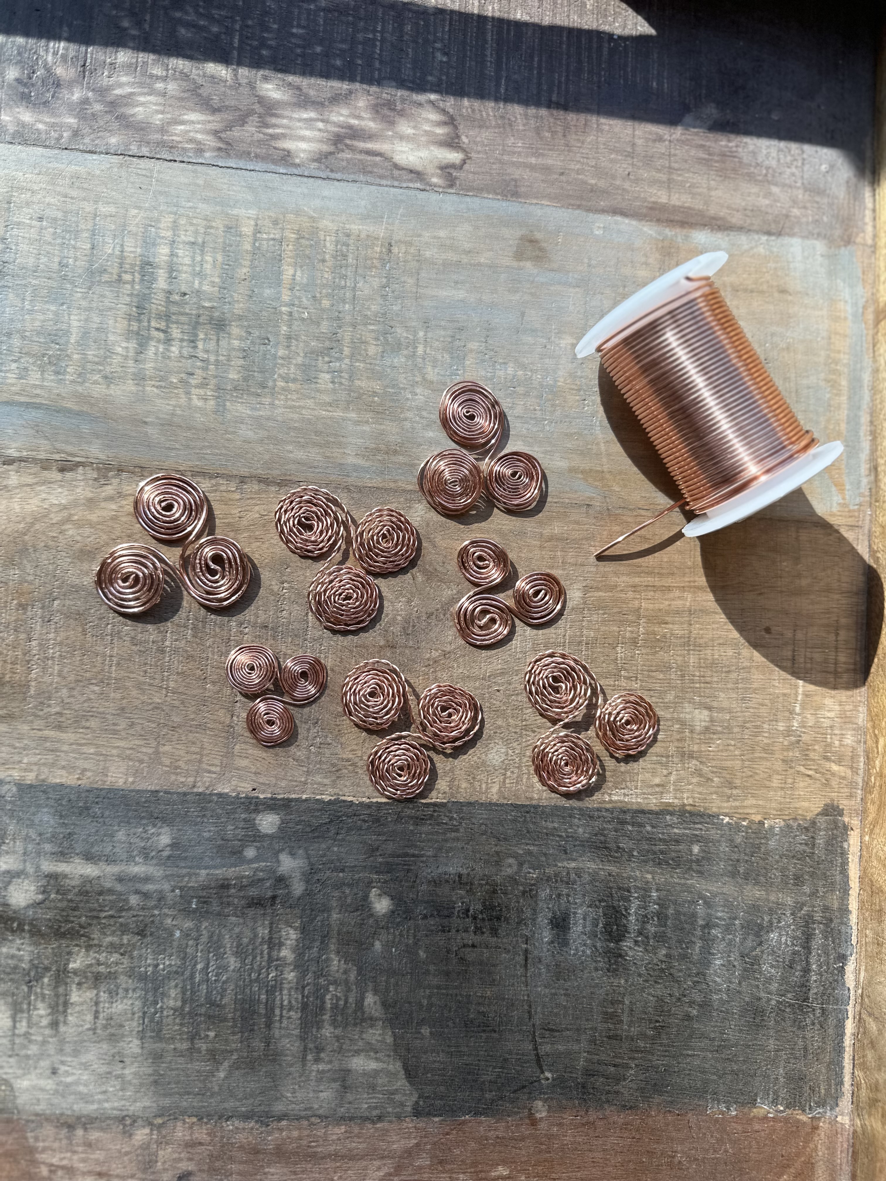 Copper triskelion, detail of spiral winding