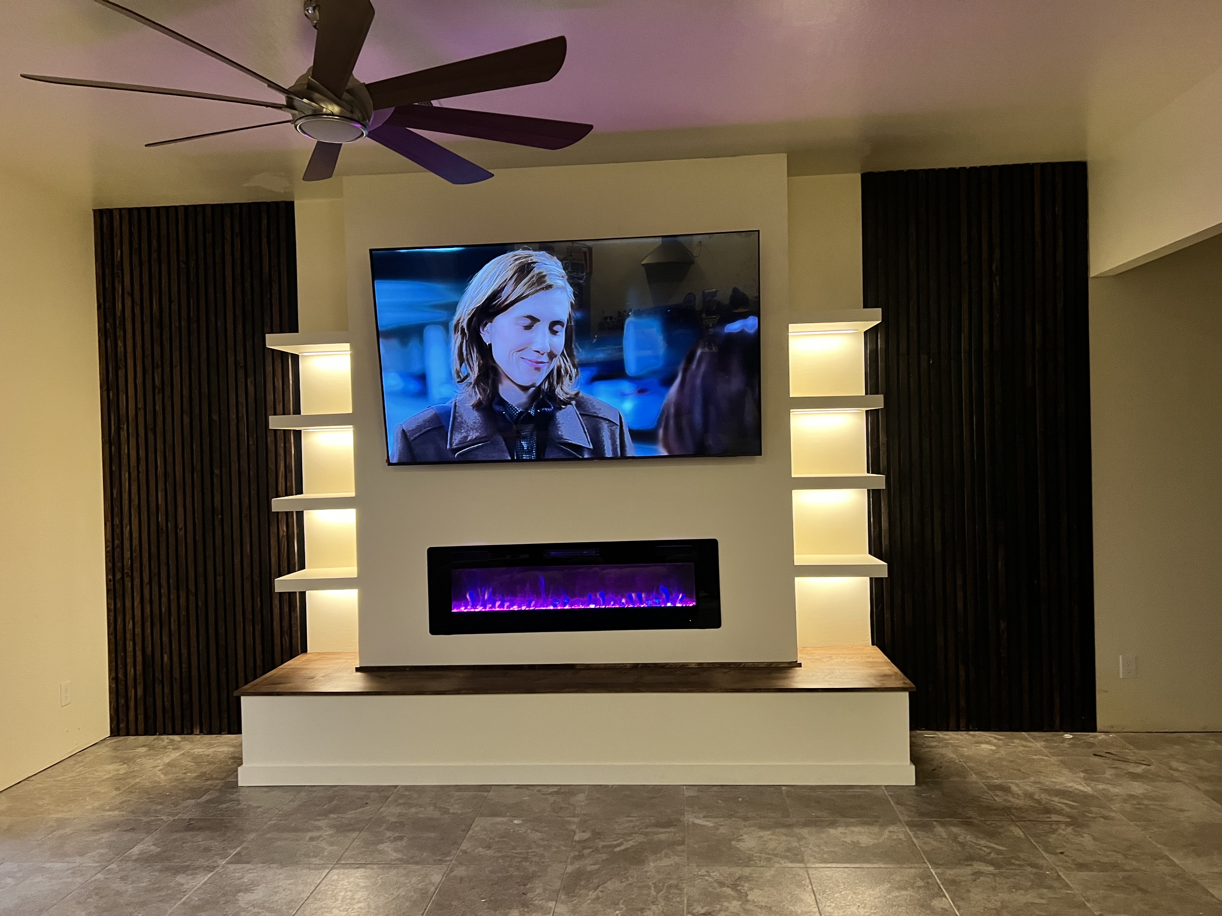 Custom TV Media Wall with Fireplace and Floating Shelves in Phoenix