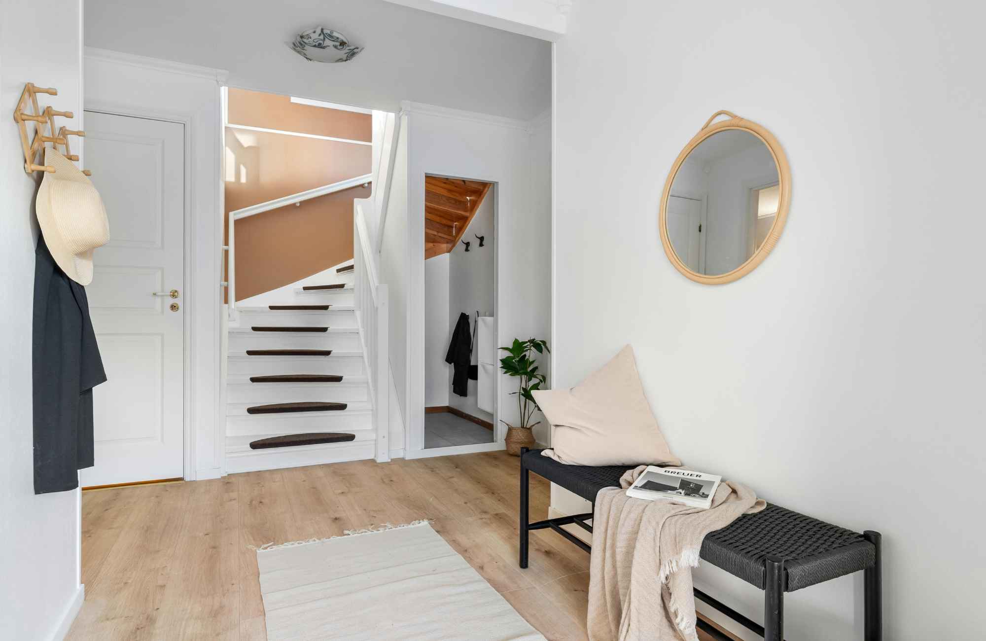 straighten-up-homes-el-segundo-ca-functional-drop-zones-entryway-with-bench-rug-hooks-for-coats-round-mirror-and-stairs-hands-on-move-out-services straighten-up-homes-el-segundo-ca-functional-drop-zones-entryway-with-bench-rug-hooks-for-coats-round-mirror-and-stairs-hands-on-move-out-services