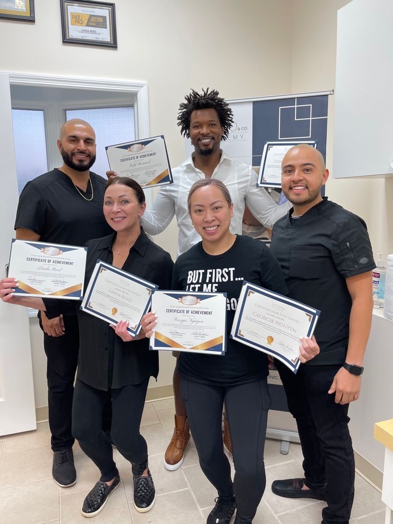 SMP Micro Pro Clinic graduates with founder Victor and their certificates of achievement