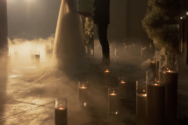 White sand candle with warm flame styled for a Cloud Dancer 2026 wedding palette. White sand candle with warm flame styled for a Cloud Dancer 2026 wedding palette.