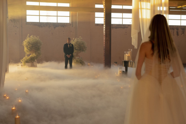 Cloud Dancer candlelit wedding aisle with sand candles, fog and mirrored plinths at The Naval Store. Cloud Dancer candlelit wedding aisle with sand candles, fog and mirrored plinths at The Naval Store.