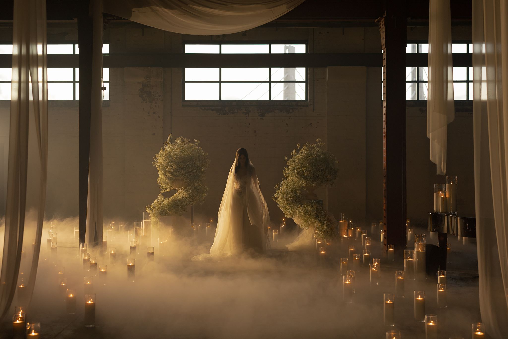 Editorial wedding installation with candlelight and fog replacing the traditional styled shoot.