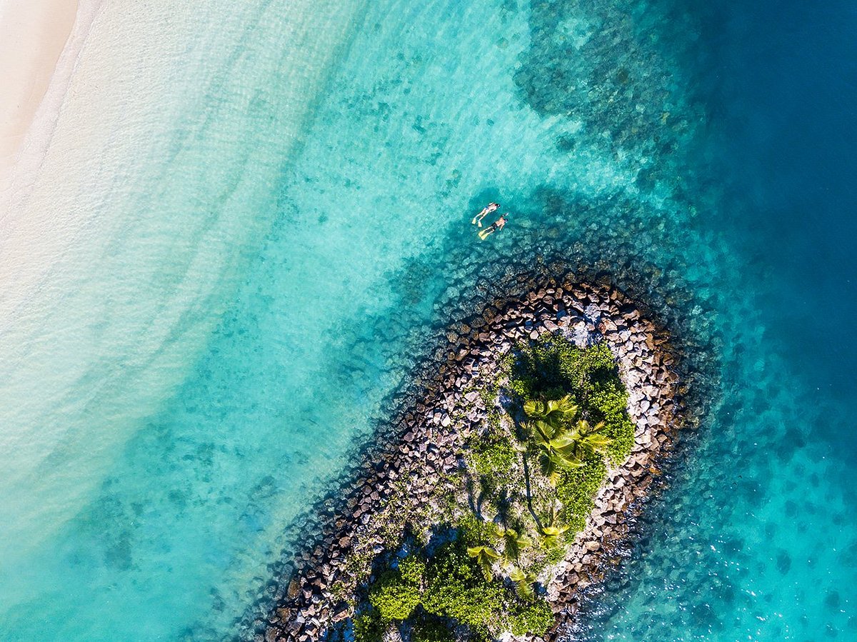 Six Senses island beach resort with open-air villa lounge