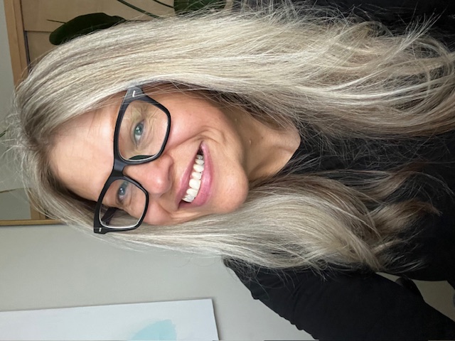 Angelika smiling at the thought of independently consulting