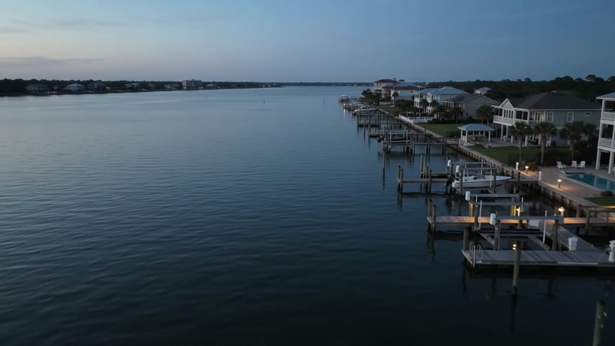 Waterfront homes and private docks at dusk along the Gulf Coast in Orange Beach, Alabama