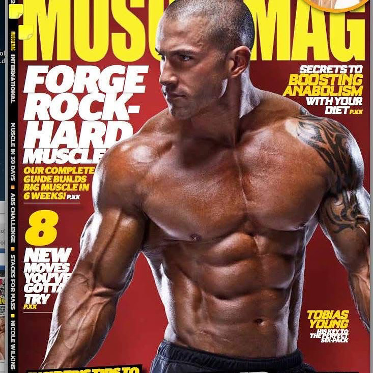 MuscleMag magazine cover with a different pose of Tobias Young, mostly red and yellow typography.