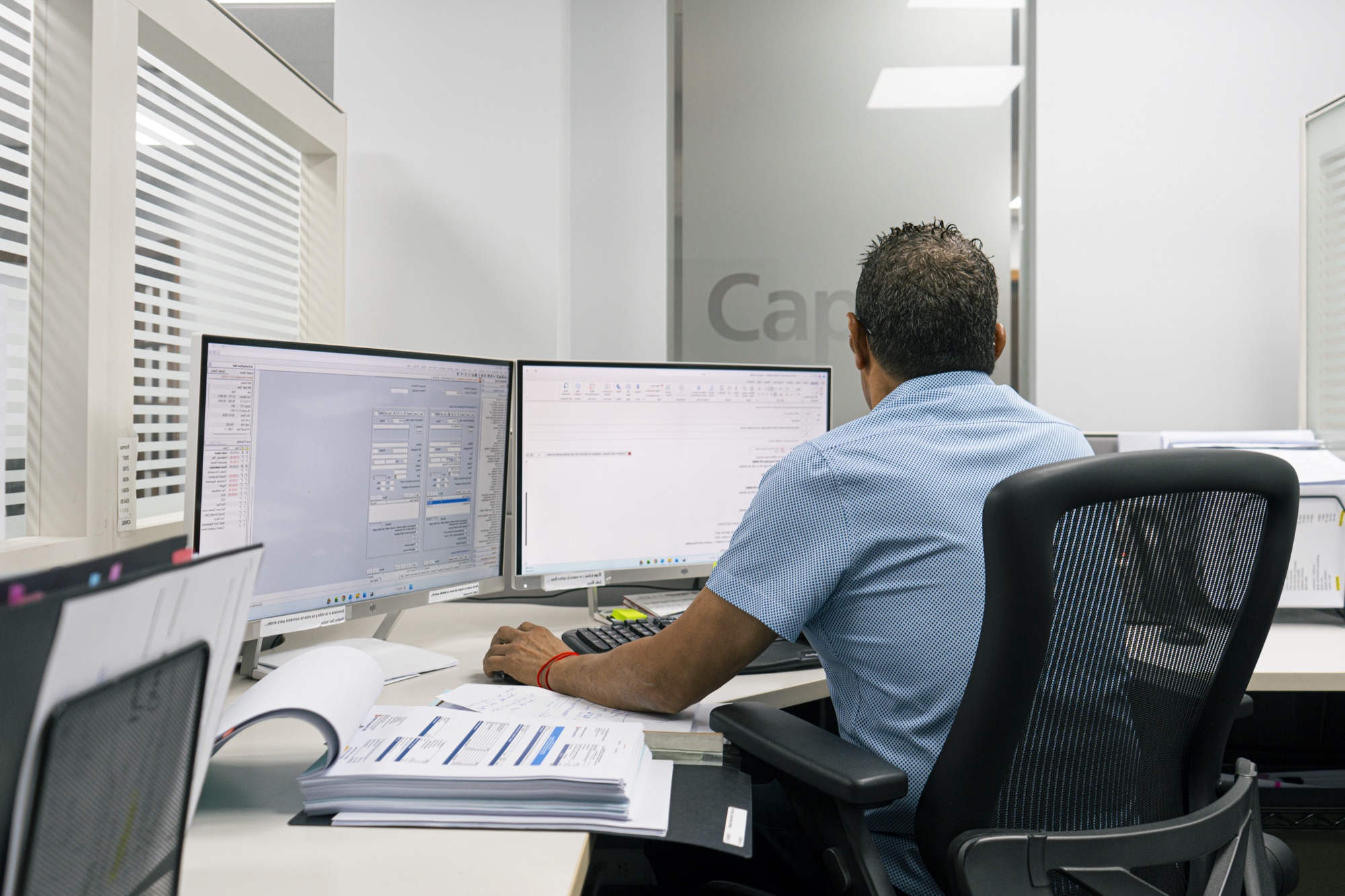 A Capital Mortgage specialist at work in the San Juan office
