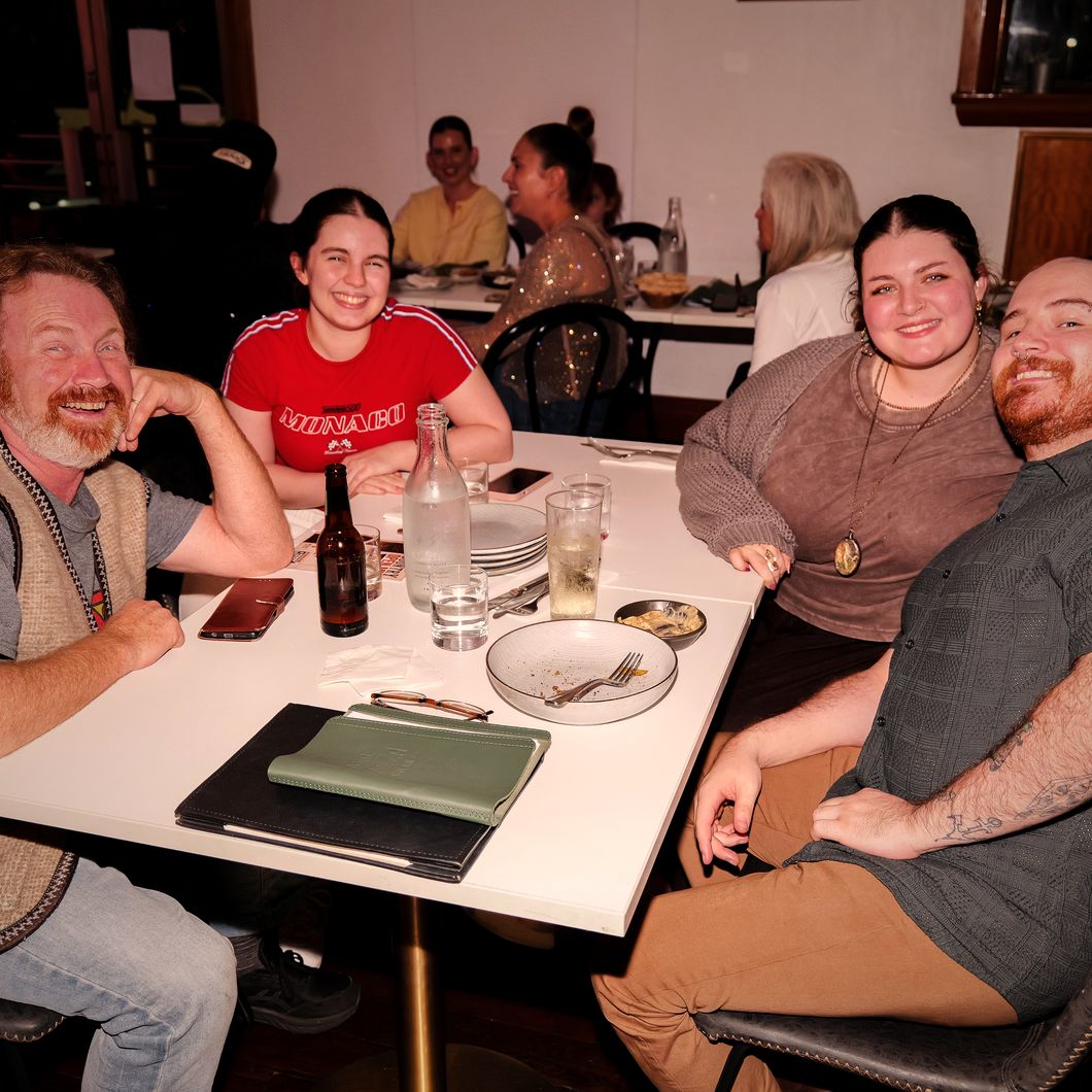 Friends at a table at Motel Mezza