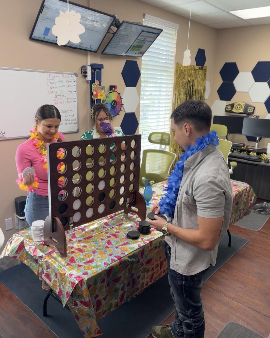 The Ritz Agency team playing a giant Connect Four game at a Friday team lunch