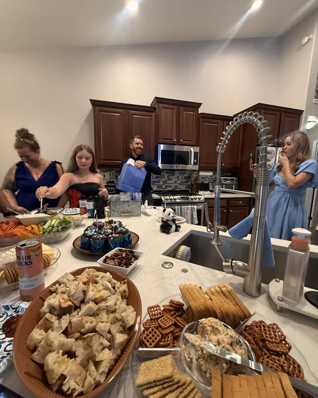 Food laid out in the office kitchen for a team celebration