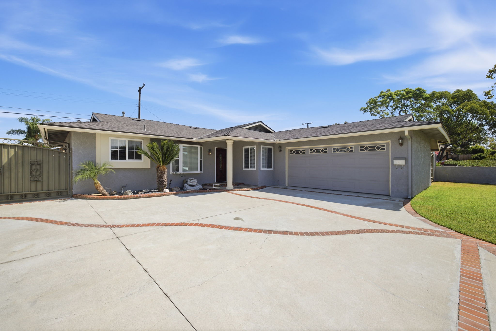 Single-story home in La Mirada, California at golden hour with a wide driveway and attached garage