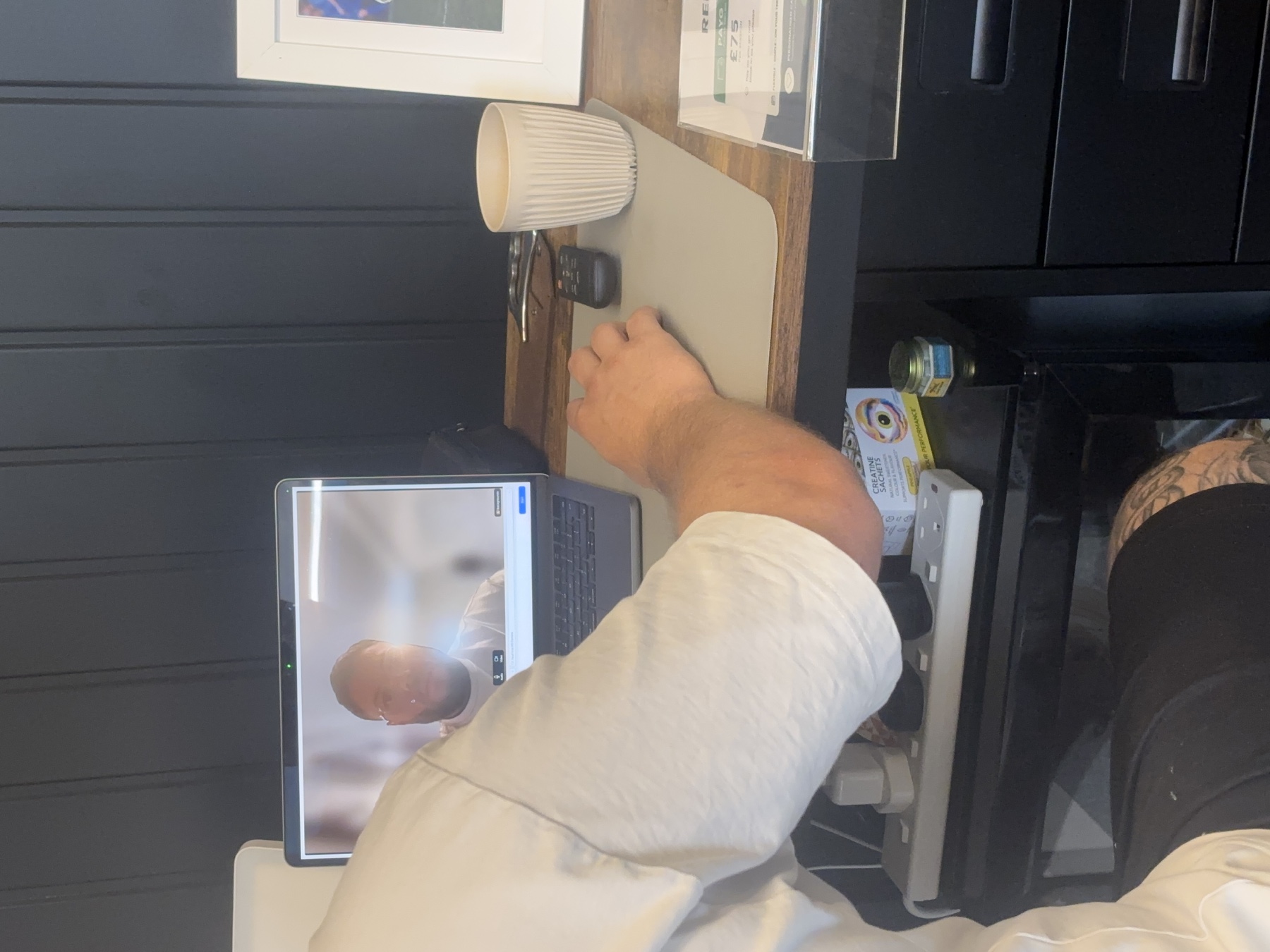 A Valley Rehab therapist leading an online assessment through Google Meet on a laptop