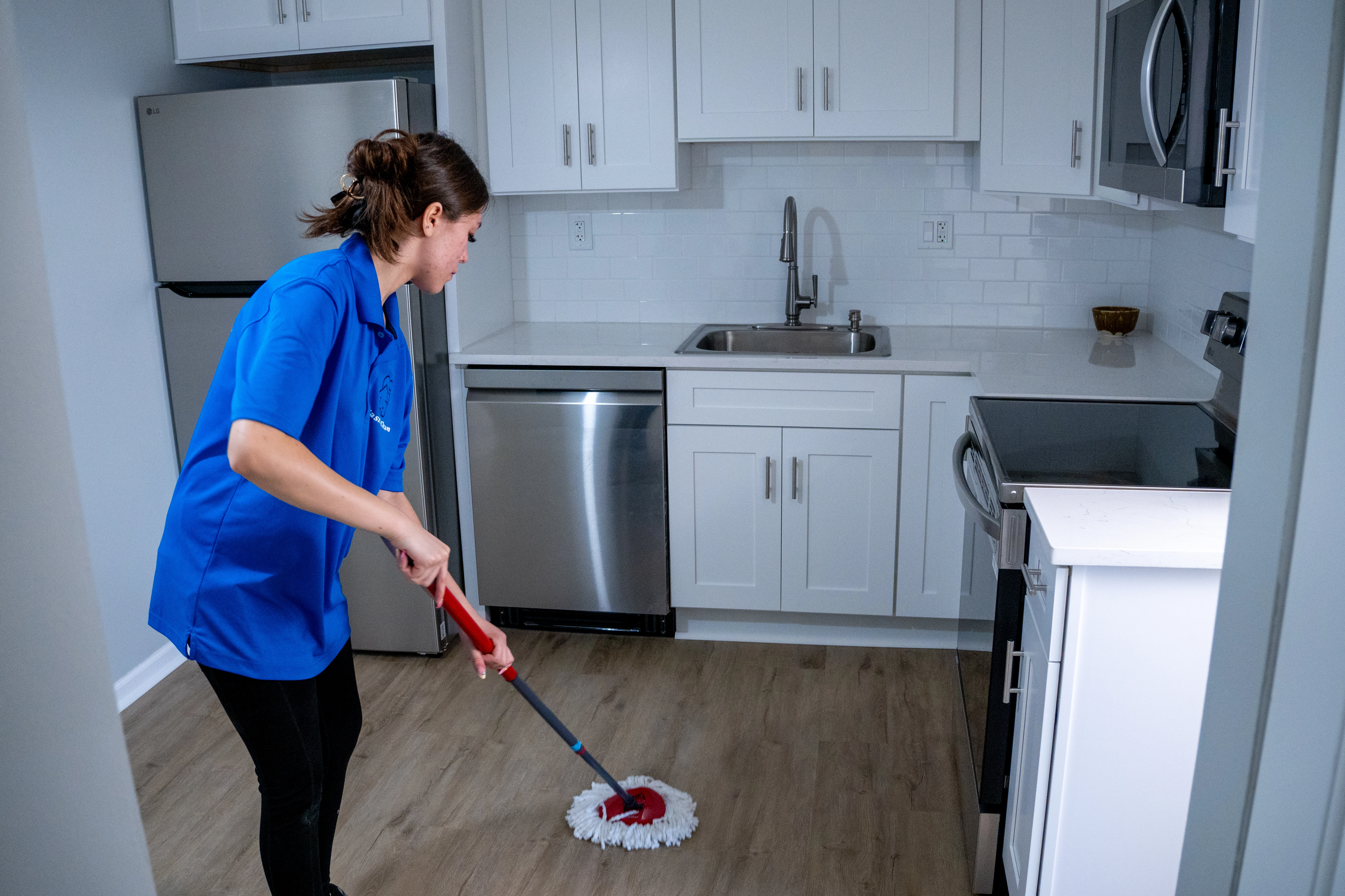 Casita Clean team member mopping the floor as part of a kitchen deep clean
