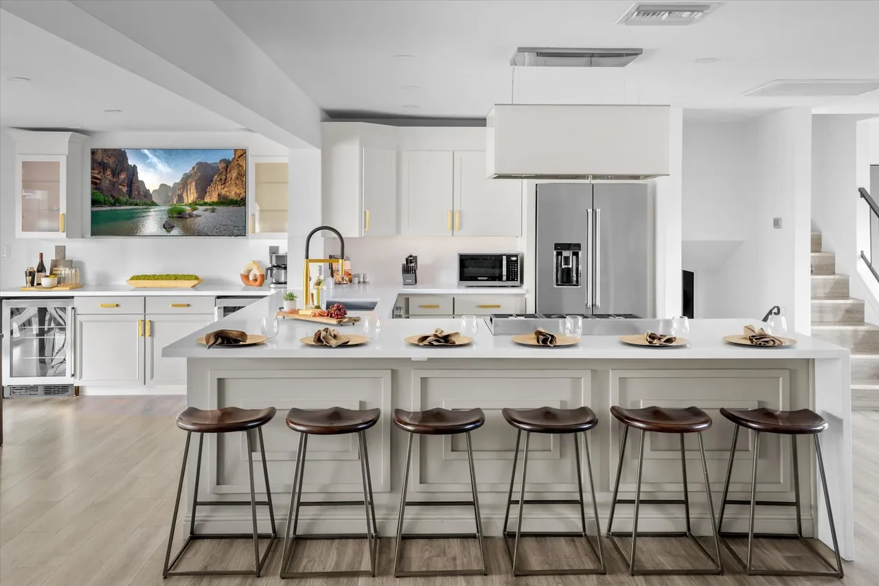 Remodeled kitchen with a long island, bar seating for six and a pro-style range