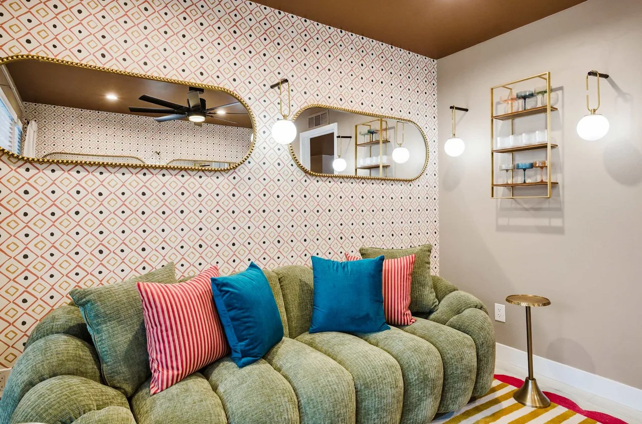 Bright lounge with a built-in bench seat in a short-term rental built by Logan Construction