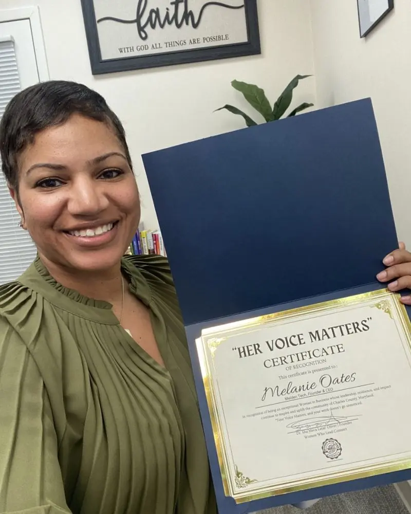 Melanie Oates receiving recognition
