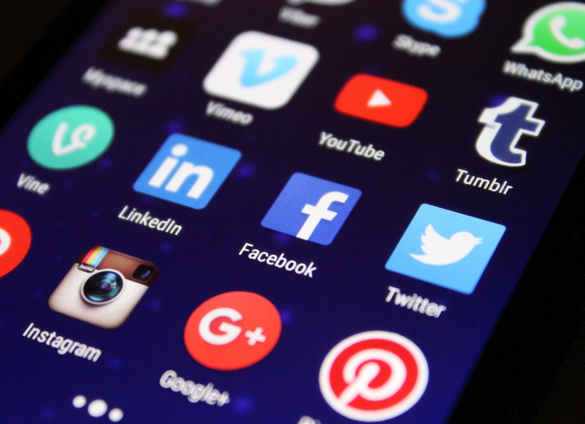 close up of social media apps facebook, linkedin, twitter, etc on smartphone